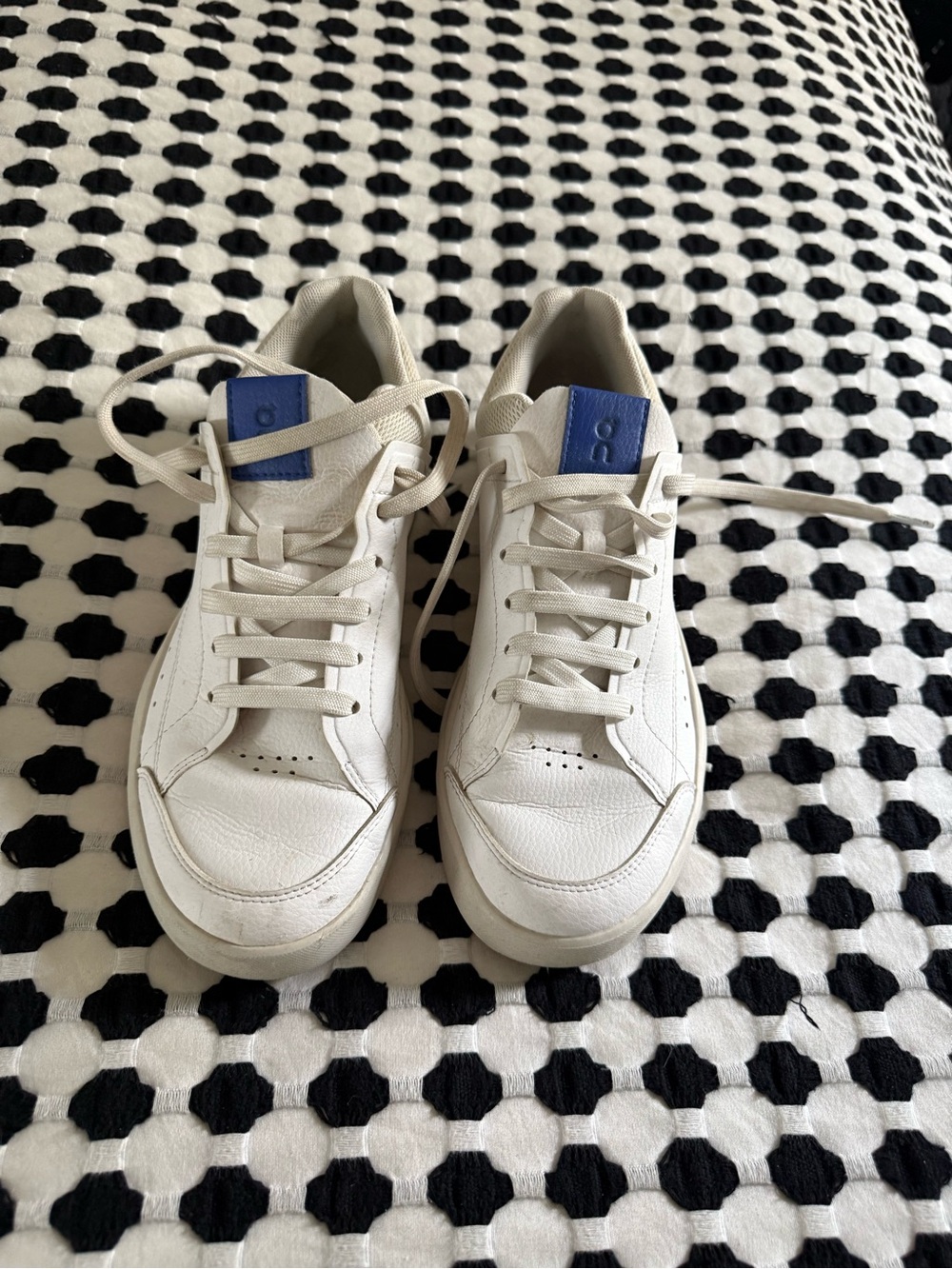 On Running White Sneakers with Blue Tongue Tab